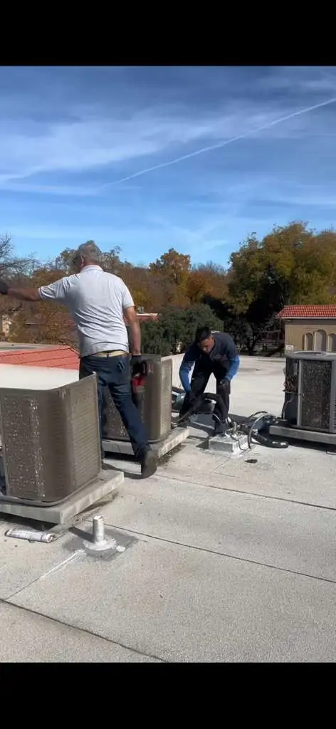 Heshma Air Conditioning technicians performing a coordinated HVAC installation